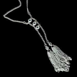 Bright silver tone faceted crystal accent dramatic tassel necklace